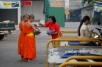Early morning alms collecting, Thailand